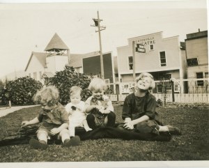 Kids in front of Theater and Methodist Church