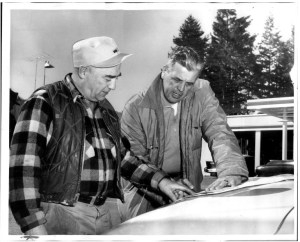 Sheriff Tim McCullough, right, examined a map of the Mount Rainier area with W. H. Smith, Eatonville town marshal, as a search continued for Joseph Self.