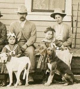Clara and John Jensen with their daughters Clara (left) and Bessie (right) holding the hunting dogs. Clara and John Jensen with their daughters Clara (left) and Bessie (right) holding the hunting dogs.