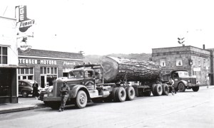 Murphy Logging truck in front of Christensen Motors on Mashell Ave. 