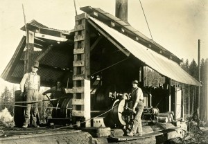 Logging using steam donkey (check out the hat)